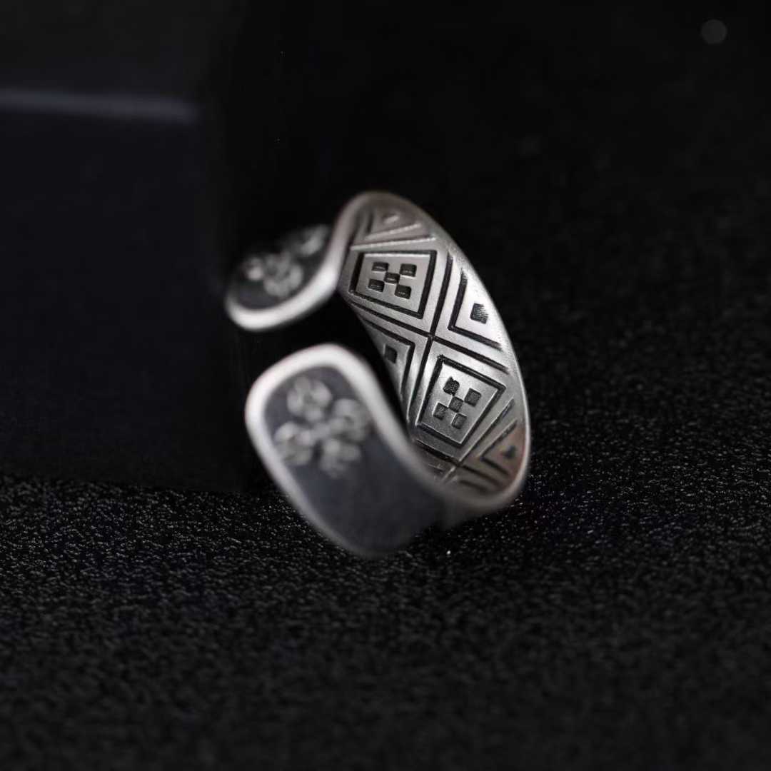 Artisan-made solid gold and silver Everest ring with precision inlay and Tibetan cultural elements.