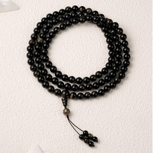 Handmade Tibetan Buddhist golden obsidian mala necklace with ash mantra beads.