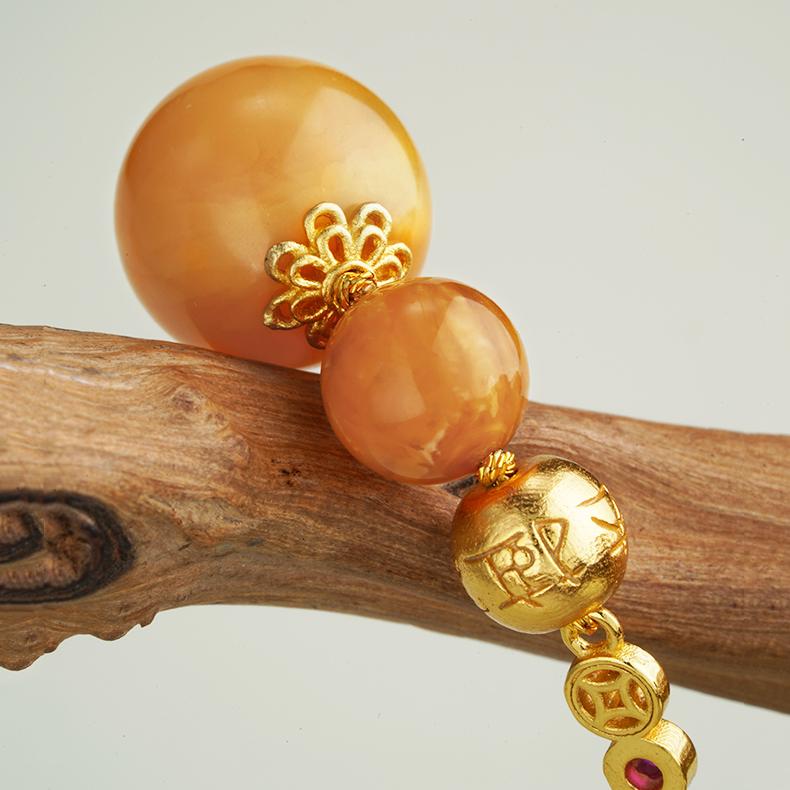 "Elegant Tibetan Buddhist amber earrings, handcrafted with 925 silver and zircon stones, symbolizing peace and unity."