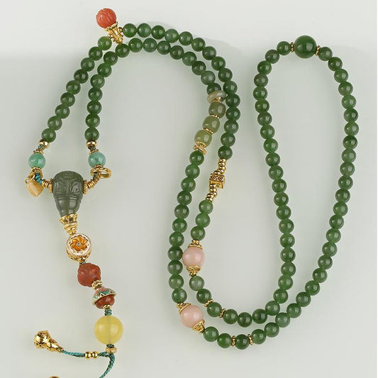 Handmade Tibetan Buddhist necklace with green jade, jadeite, amber, and south red agate for prosperity and peace.