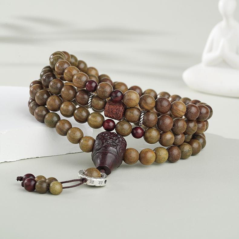 Handcrafted green sandalwood bead string inspired by Tibetan spiritual jewelry traditions.