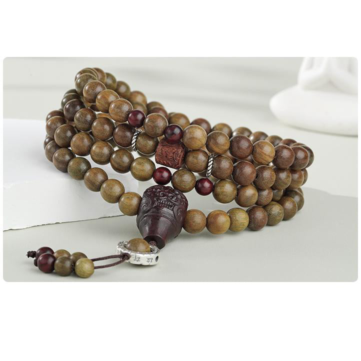 Green sandalwood and purple sandalwood bracelet with sterling silver cloud charm.