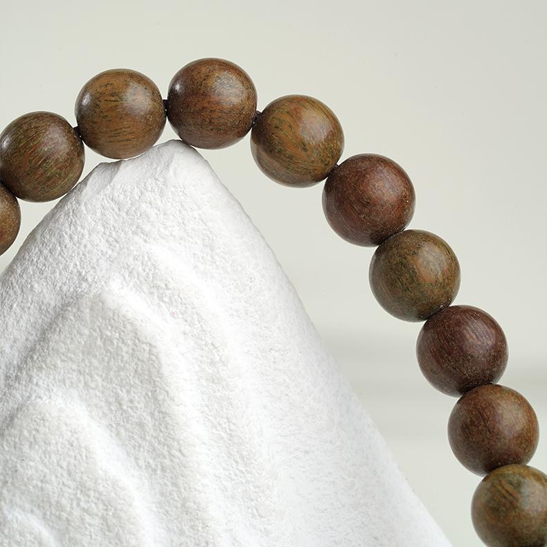 Tibetan Buddhist handcrafted wooden mala with green sandalwood and bloodwood center beads.