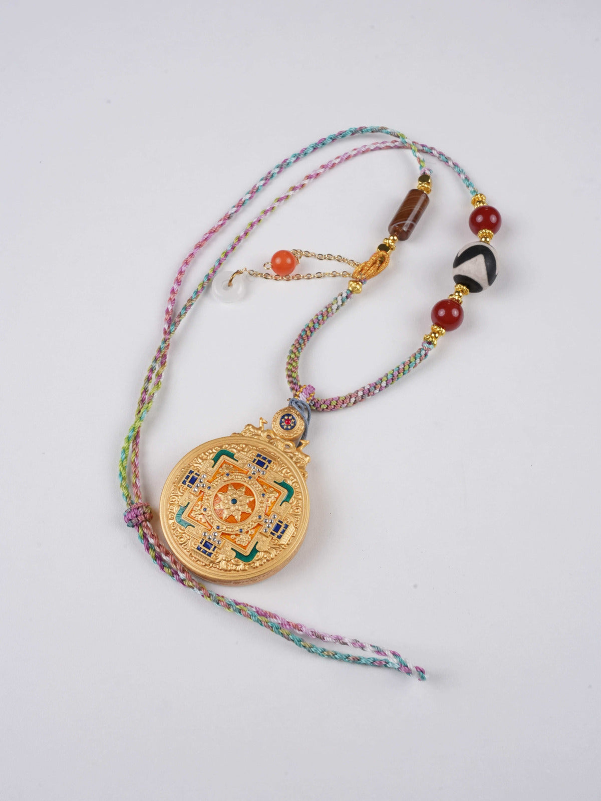 Authentic Tibetan Buddhist Thangka amulet featuring Green Tara for peace and healing.