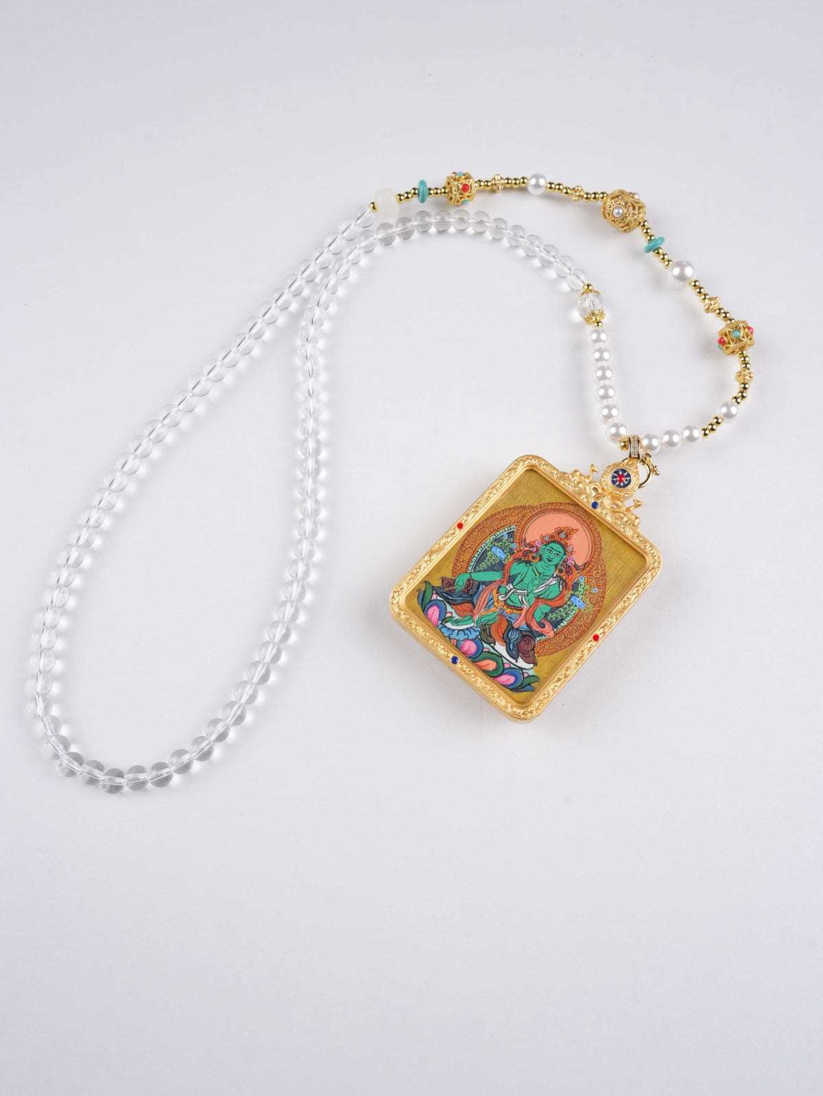 Green Tara zodiac guardian amulet, handcrafted using mineral pigments in traditional Thangka style.