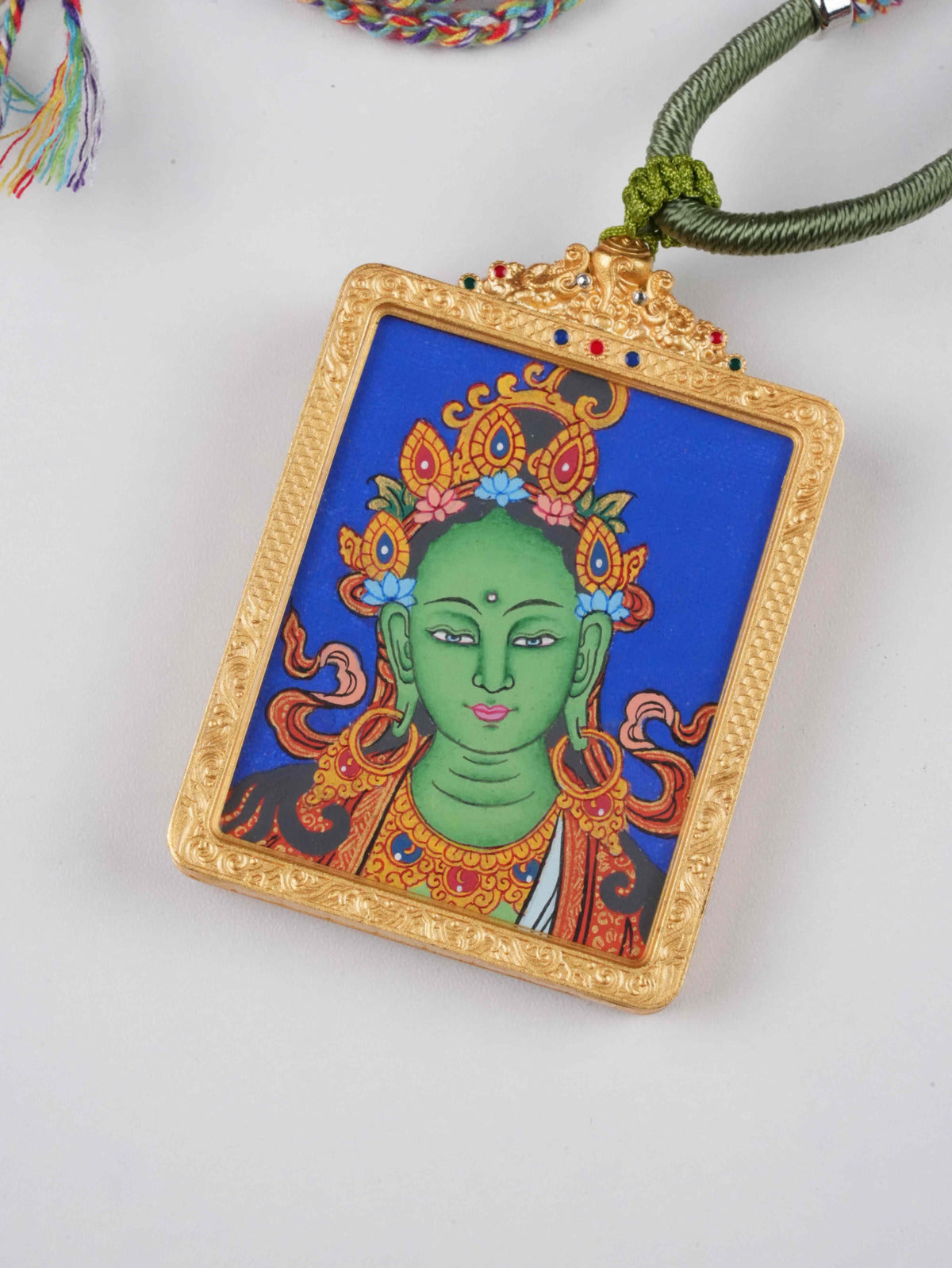 Authentic Tibetan Thangka of Green Tara, fully hand-painted using vibrant mineral colors in traditional thangka style.