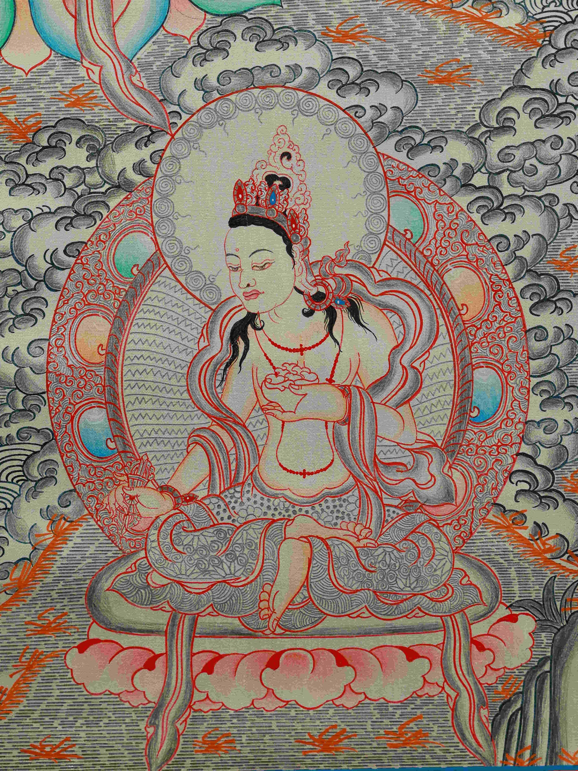 Sacred handmade Tibetan Thangka of Green Tara with silver foil, 75x50cm, enhancing spiritual energy.