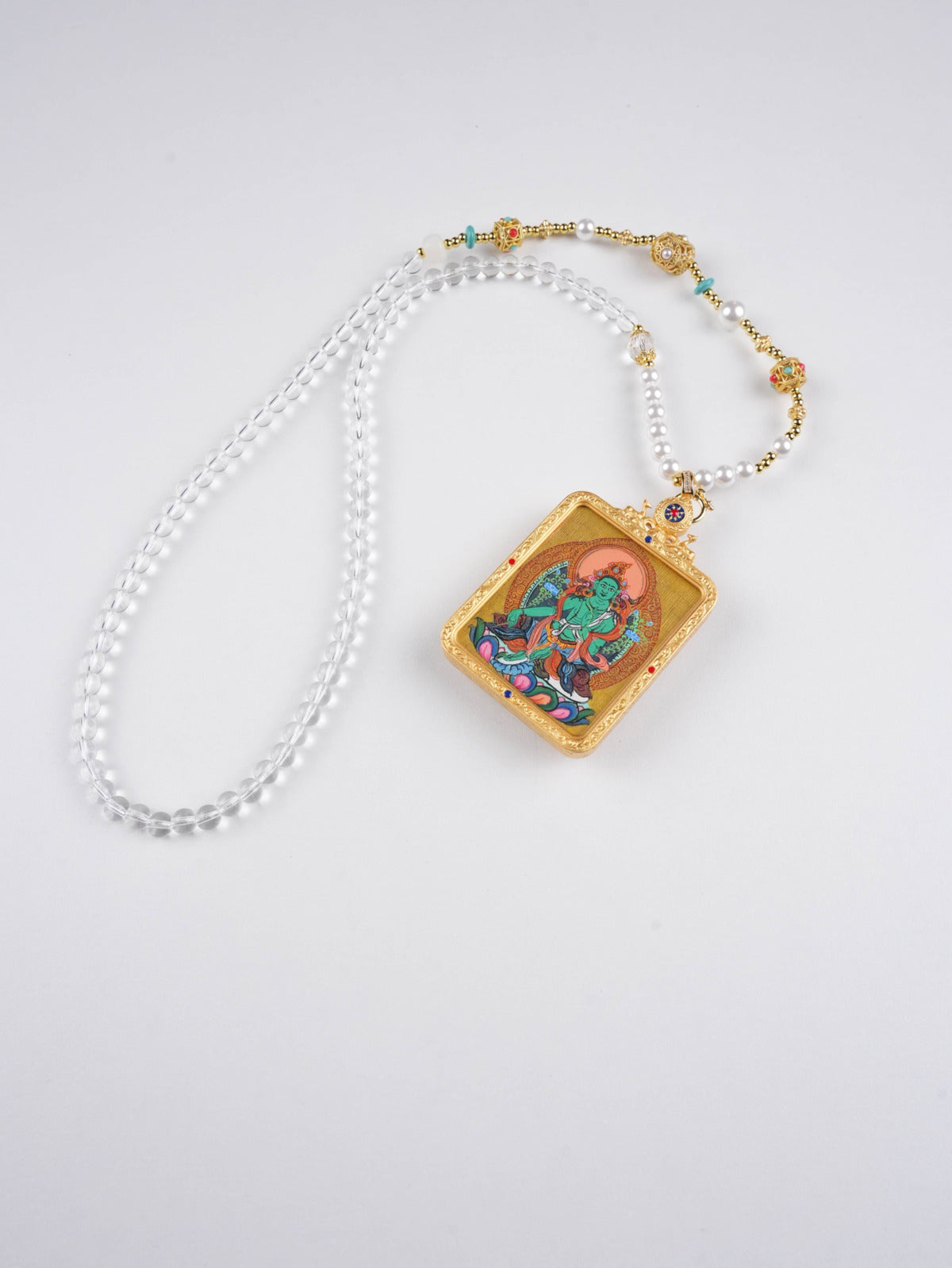 Tibetan Buddhist Green Tara Thangka pendant for prosperity, protection, and peace.