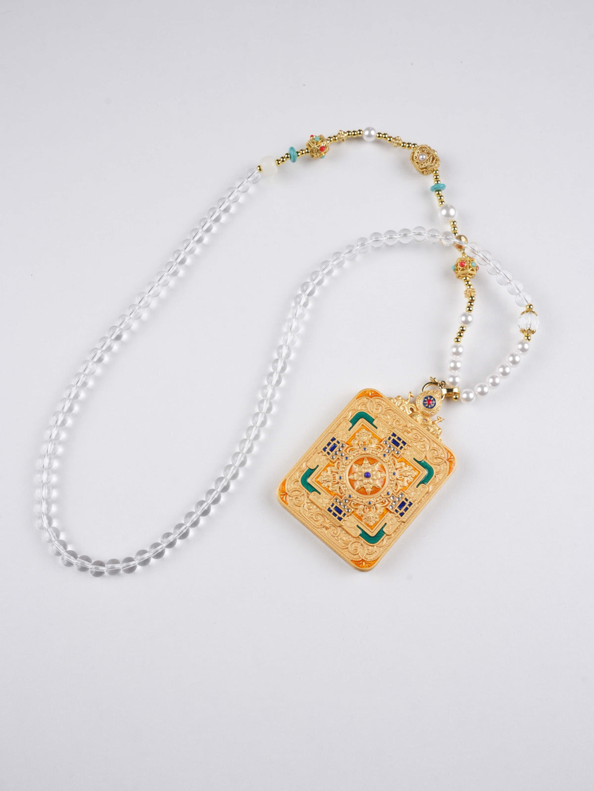 Portable Green Tara Thangka pendant for compassion, longevity, and family protection.