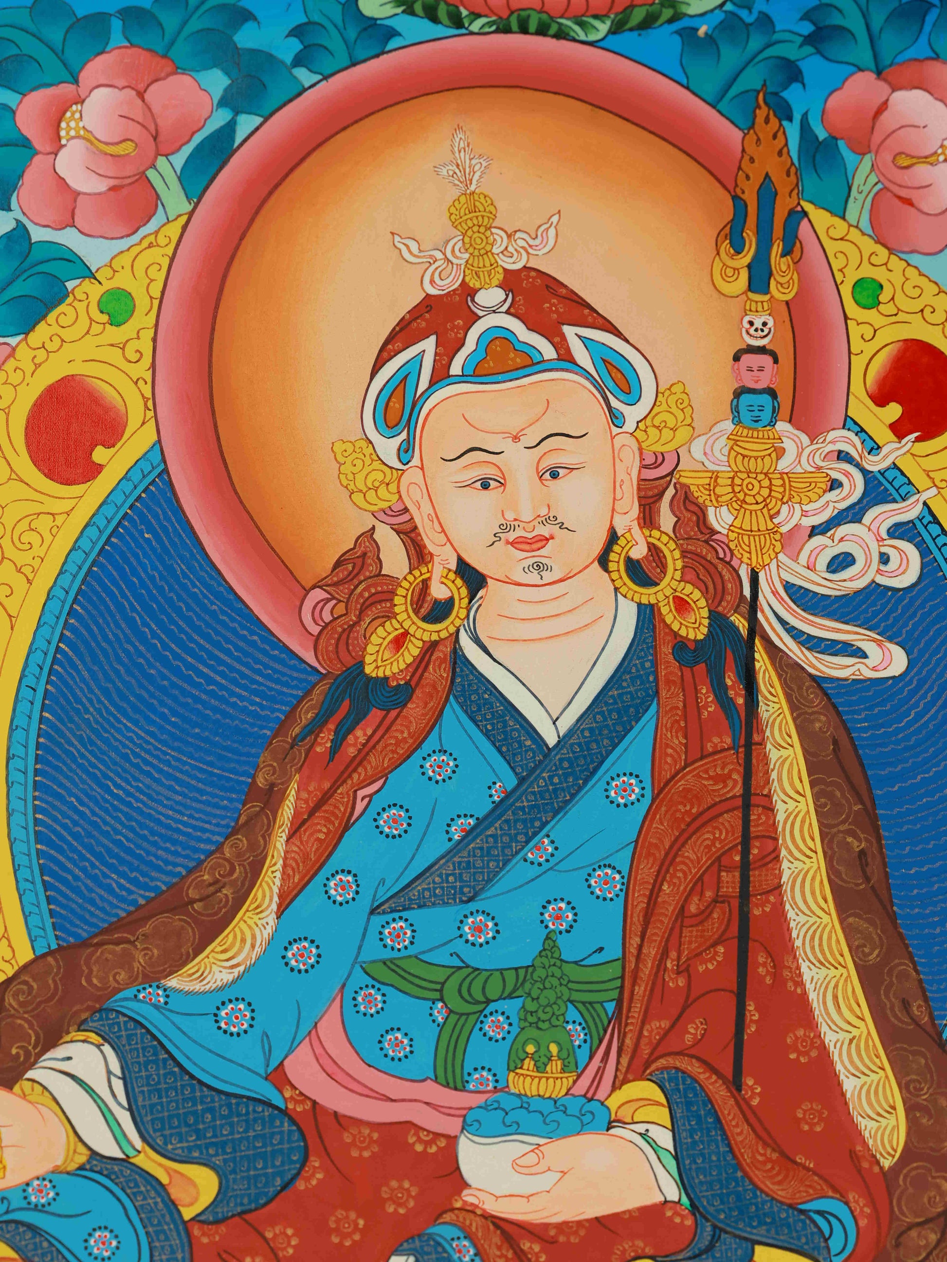 Traditional Padmasambhava Thangka in vibrant mineral tones, representing compassion and enlightenment in Tibetan Buddhist art.
