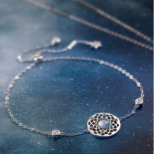 Hand-painted enamel earrings inspired by Tibetan Buddha and Buddhist art traditions.