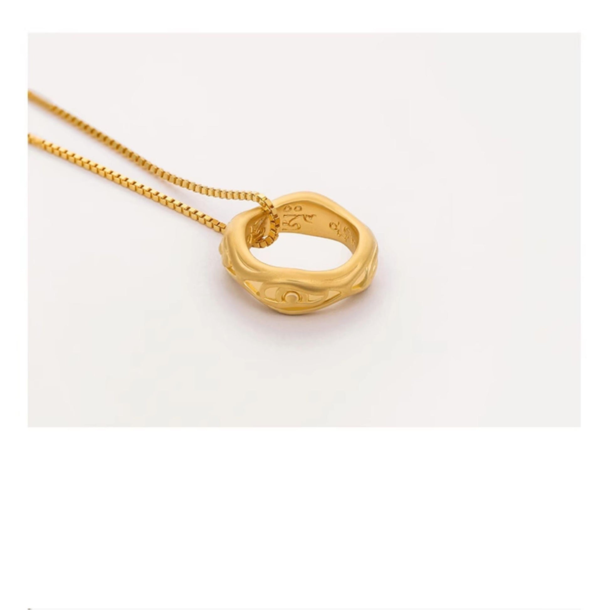 Handcrafted Tibetan 24K gold eye pendant representing clarity and inner awakening.