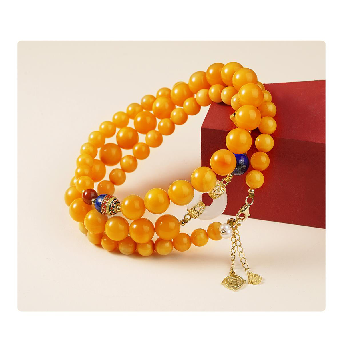 Amber and silver necklace symbolizing wisdom, purity, and compassion, inspired by Tibetan jewelry art.