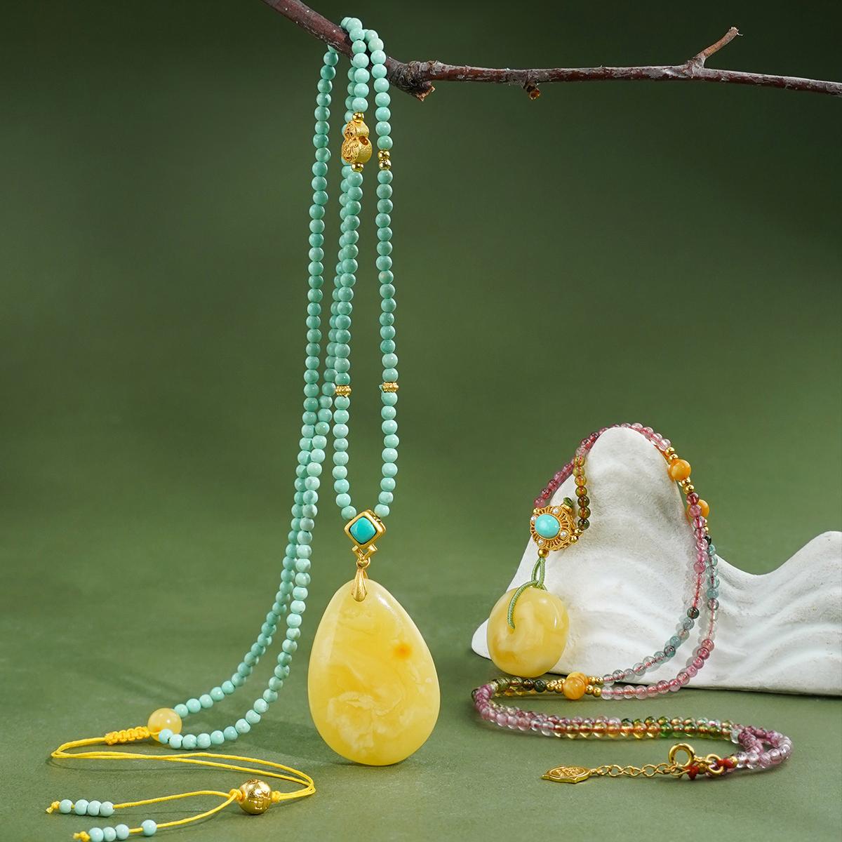 Handmade Tibetan Buddhist amber amulet pendant with turquoise and silver, enhancing inner peace.