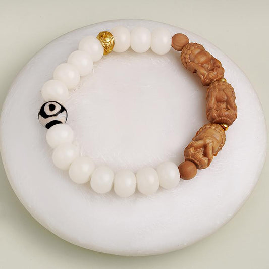 Handcrafted Tibetan-Buddhist Bodhi seed bracelet with 925 silver Wisdom Eye and Barbie sandalwood carving