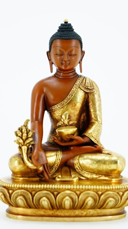 Alt text: A handcrafted Tibetan Buddhist Buddha statue, bathed in golden light, representing the profound philosophy and spirituality of Buddhism. This piece is perfect for meditation, blessings, or as a valuable Tibetan cultural art collectible.
