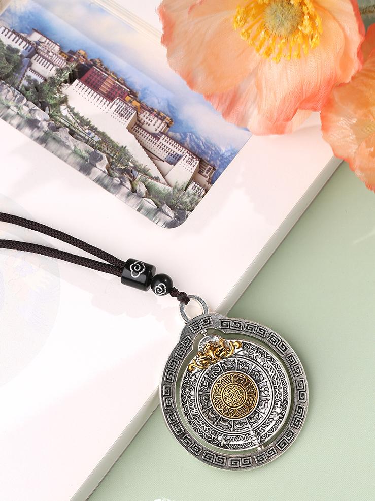 Handmade Tibetan Buddhist copper Bagua necklace pendant with symbolic feng shui meaning of peace and protection.