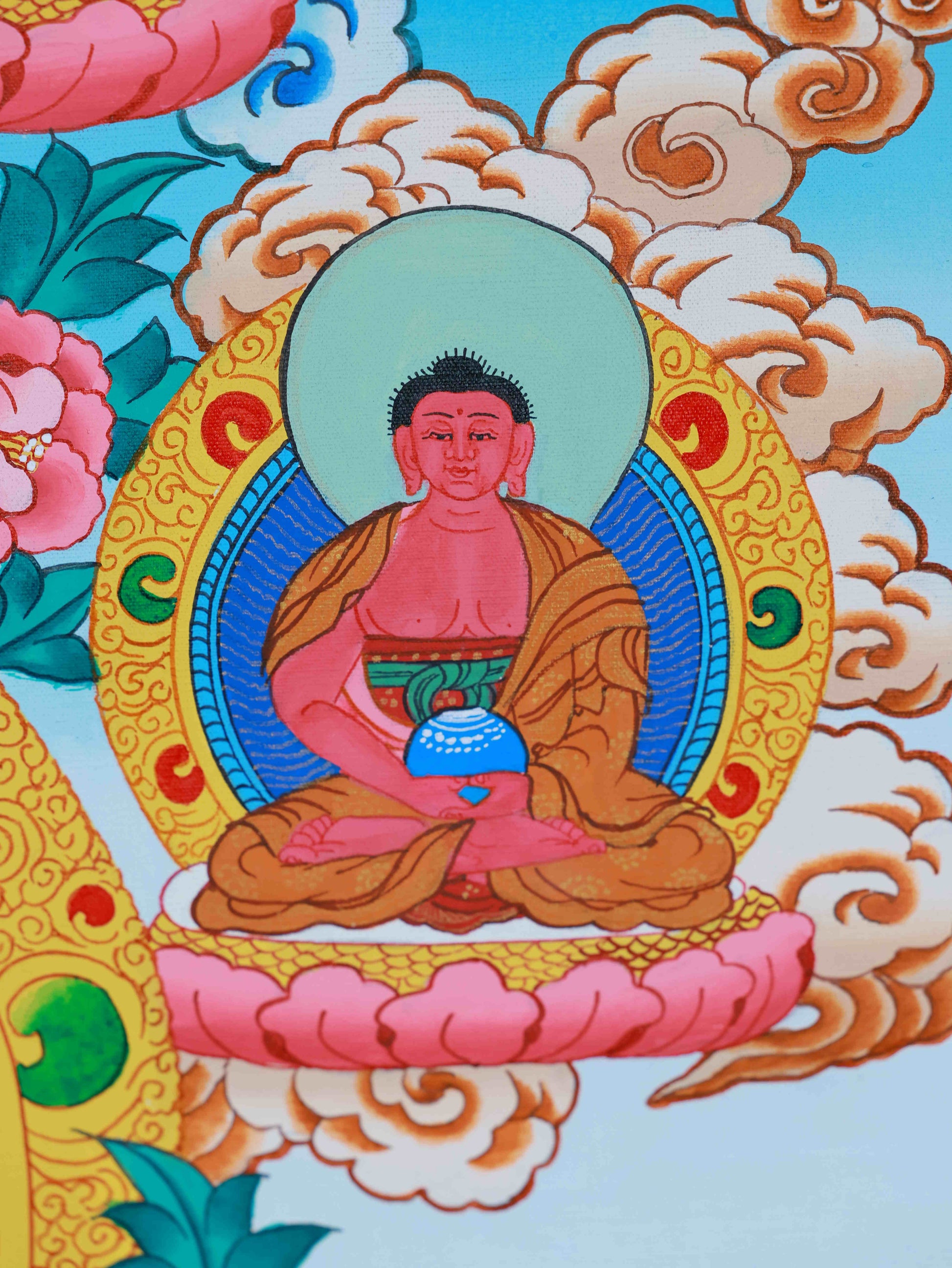 Classic Tibetan Thangka of Medicine Buddha, hand-painted on canvas with detailed patterns and sacred symbolism.