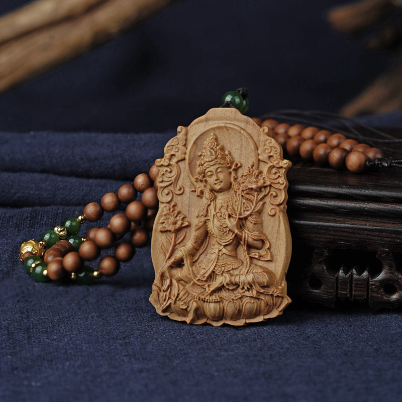 Exquisite Tibetan Buddhist sandalwood necklace featuring amber and sterling silver accents, promoting peace and balance.