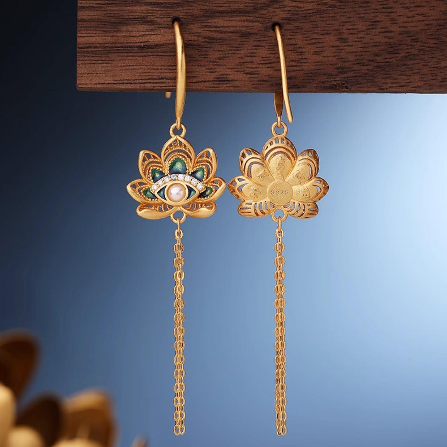 Tibetan Buddhist handcrafted pearl earrings inspired by the Wisdom Eye and lotus symbolism.