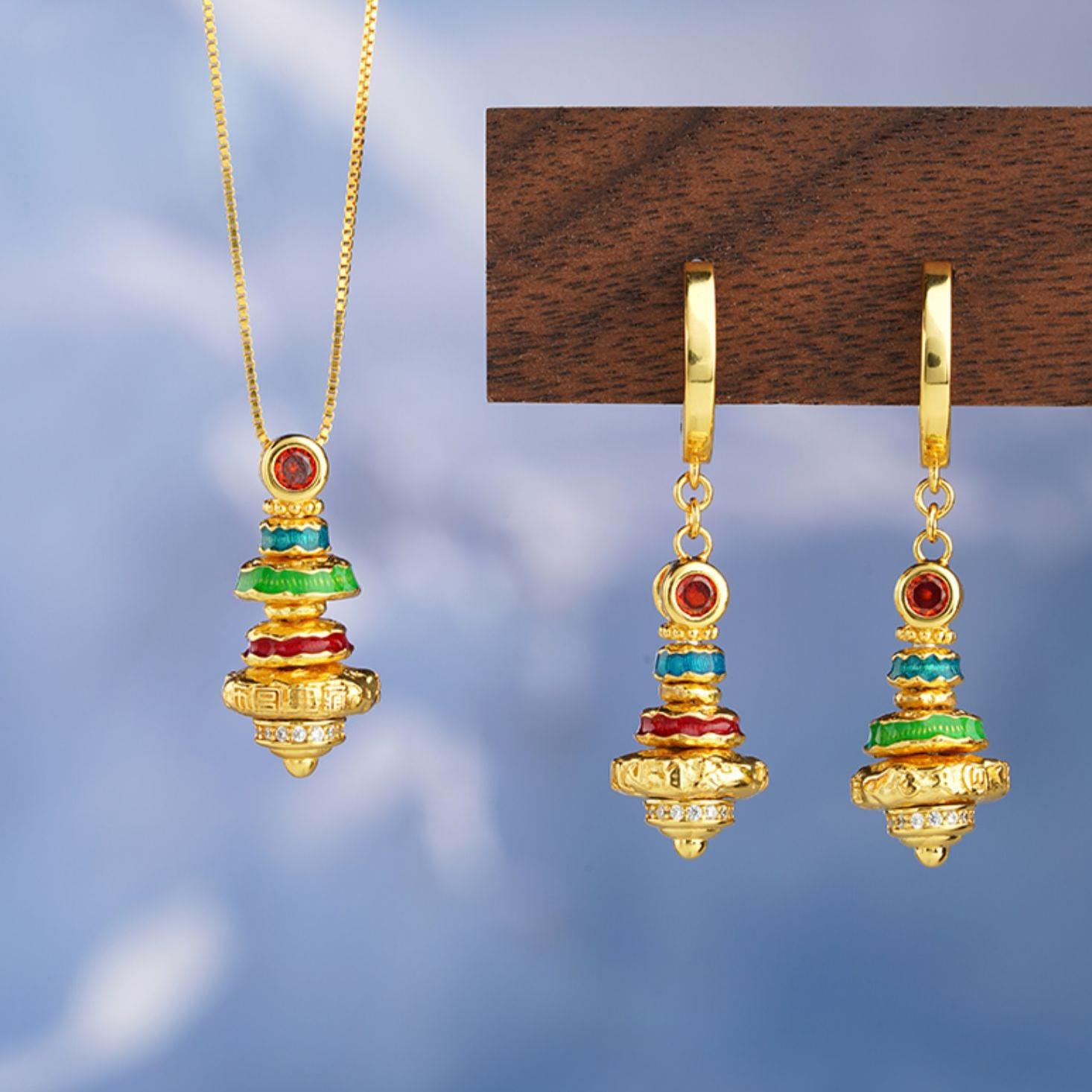 Artisan Tibetan silver earrings inspired by Buddhist aesthetics and spiritual jewelry art.