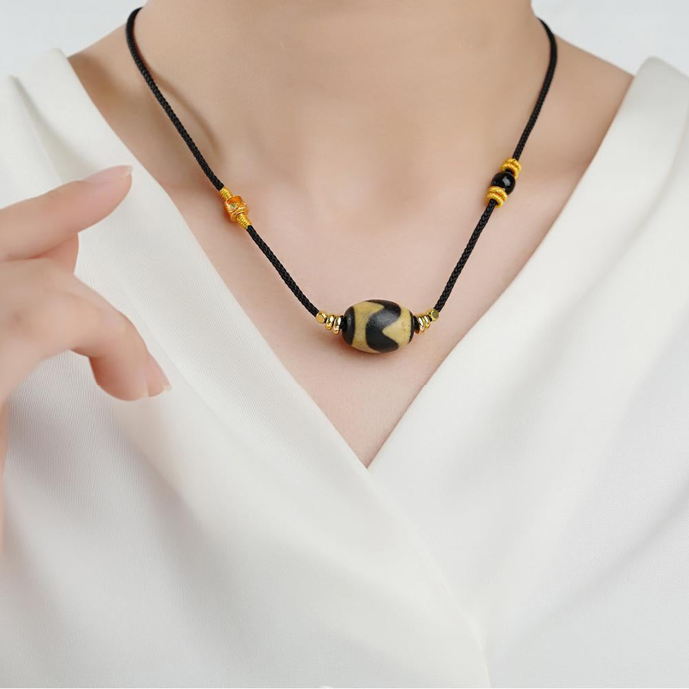 Tibetan Buddhist Tiger Tooth Dzi Necklace – handmade agate jewelry for balance and protection