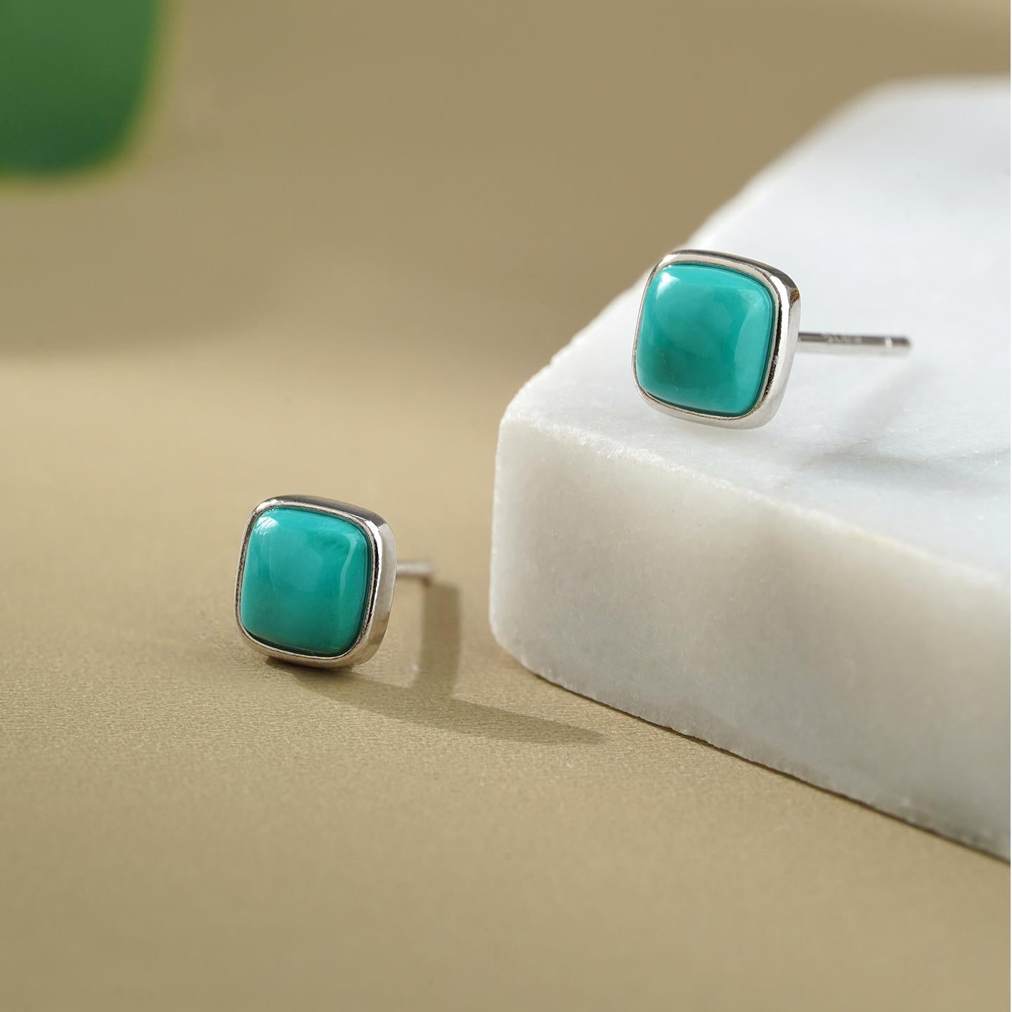 Tibetan-Buddhist turquoise drop earrings inspired by Buddha art, symbolizing wisdom and compassion in Tibetan culture.