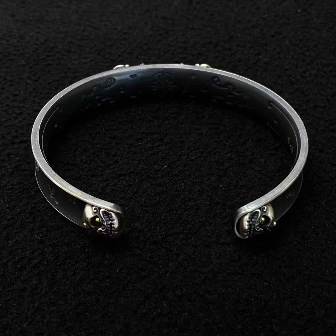 Sacred Vajra bracelet featuring detailed Tibetan Buddhist design in pure gold and sterling silver.