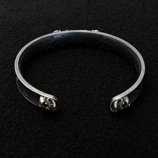 Sacred Vajra bracelet featuring detailed Tibetan Buddhist design in pure gold and sterling silver.