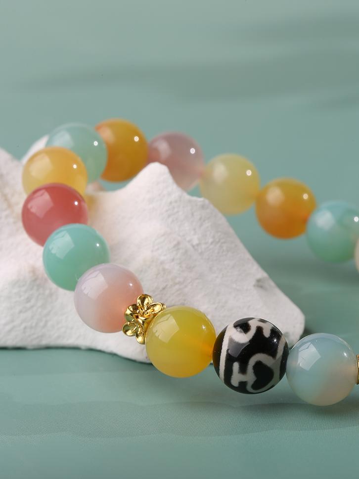 Tibetan-Buddhist agate bracelet with Zaki charm and handcrafted Dzi-style bead design