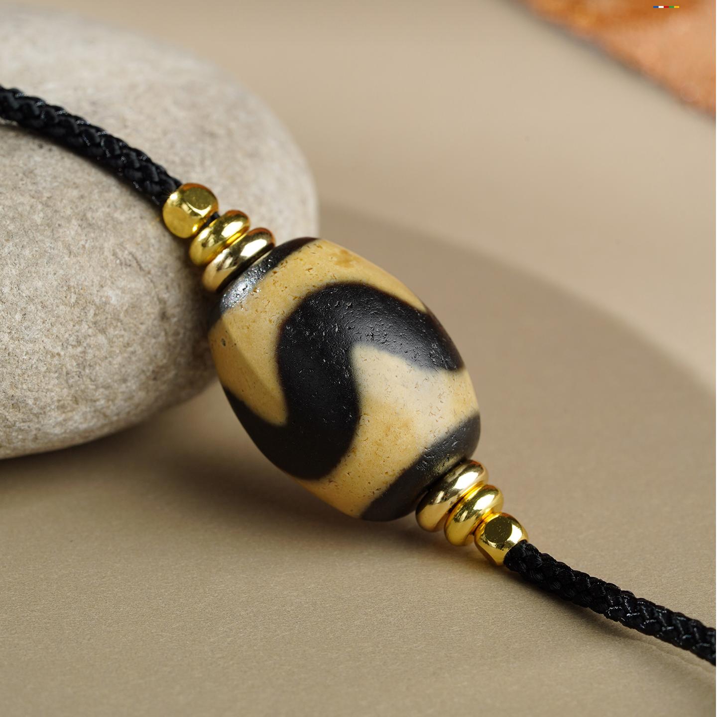 Handcrafted Tibetan Buddhist Tiger Tooth Dzi Bead Amulet made of agate for spiritual strength and calmness