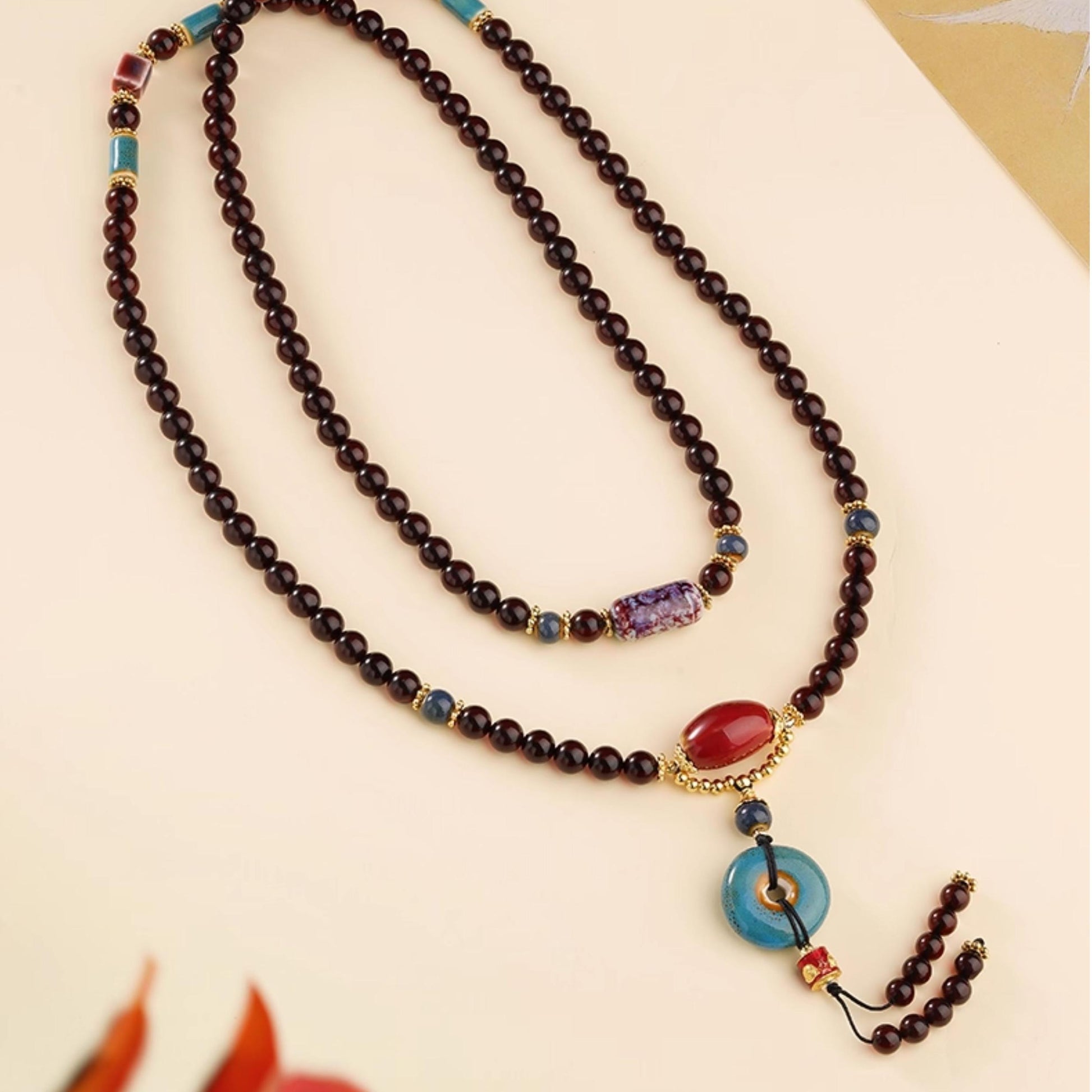 Blood amber mala necklace with ceramic beads and copper Five Wealth God pendant