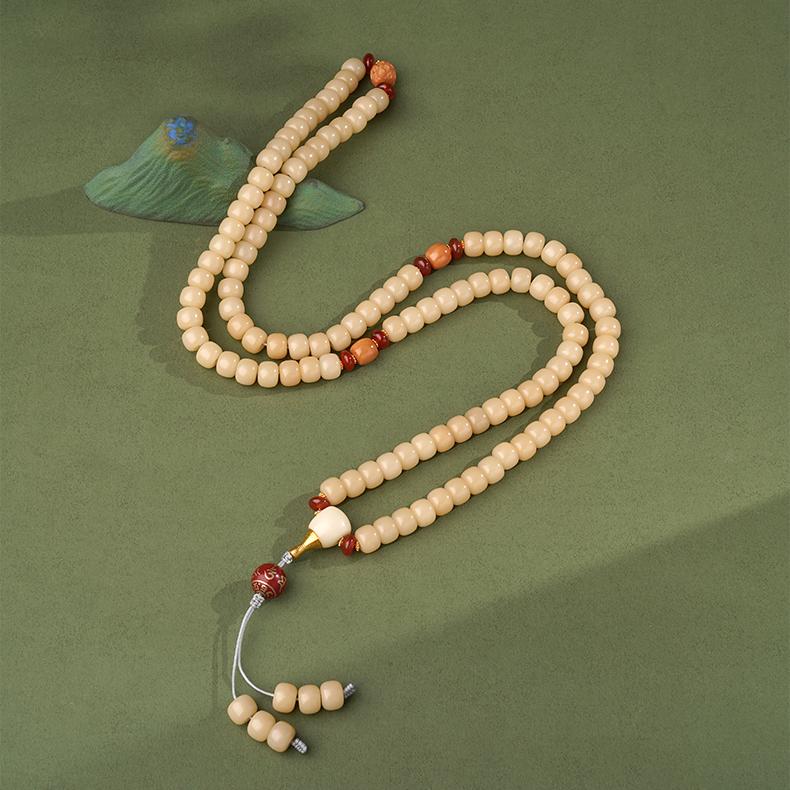 Bodhi and monkey head bead necklace crafted with glass and copper, inspired by Tibetan Buddhist jewelry art.