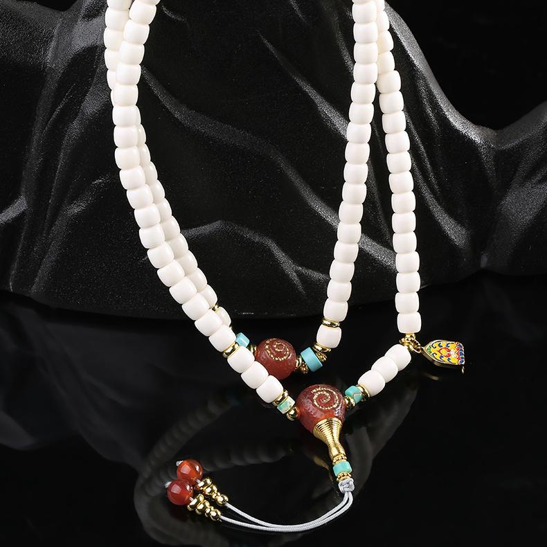 Tibetan Buddhist bone mala with five treasure brass plaque and lampwork glass beads