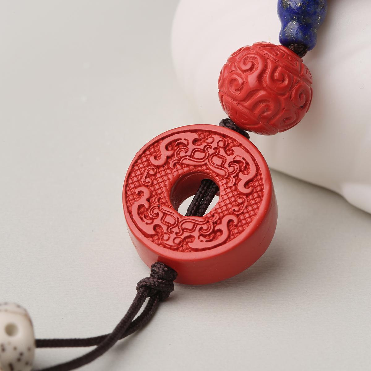 Handmade bodhi seed and cinnabar prayer mala with lapis lazuli accents

