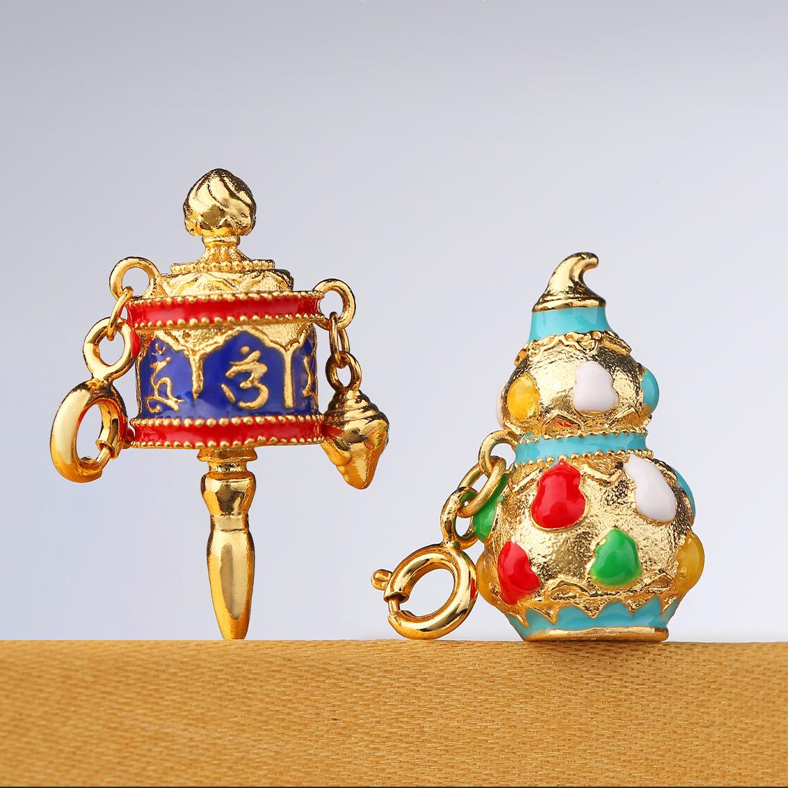 Handcrafted enamel gourd pendant embodying joy and abundance.