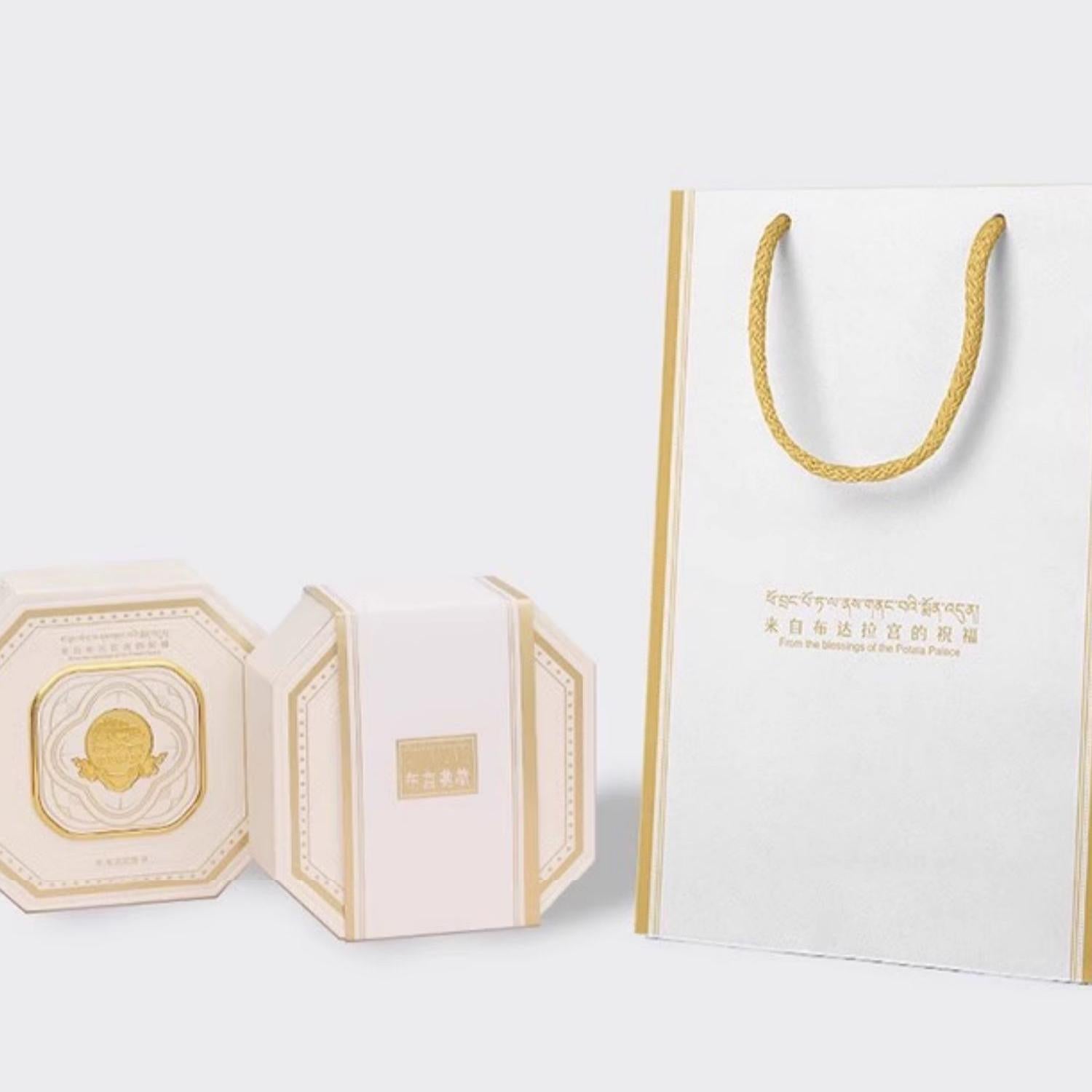 "Tibetan Buddhist spiritual earrings in 925 silver with 18K gold and zircon, symbolizing the turning wheel of fortune and blessings."