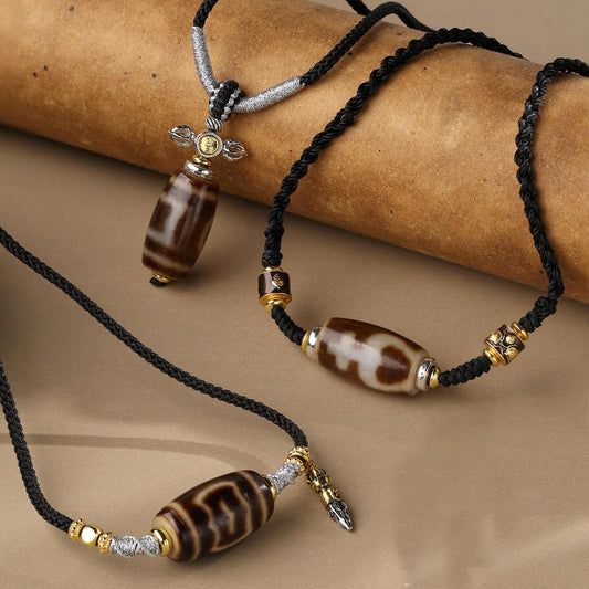 Tibetan Buddhist agate necklace with Garuda bird Dzi bead, handcrafted amulet jewelry.