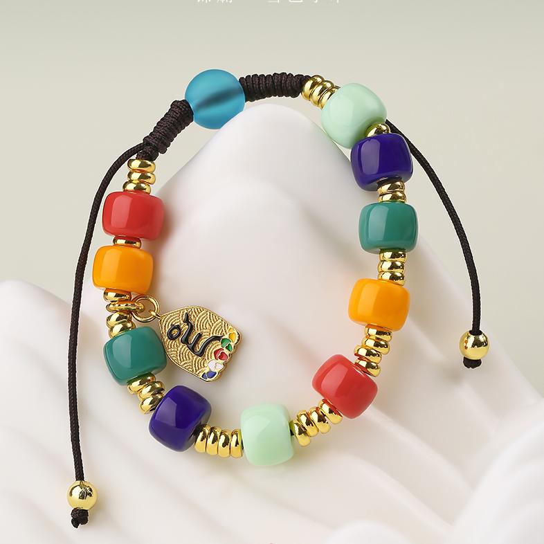 Handmade Tibetan-Buddhist Sherpa charm bracelet with translucent glass and copper beads