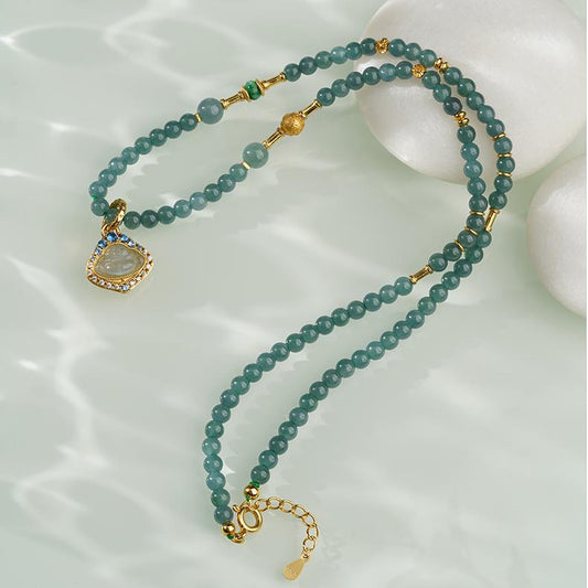 Tibetan Buddhist jade Buddha pendant necklace symbolizing peace, wisdom, and compassion.