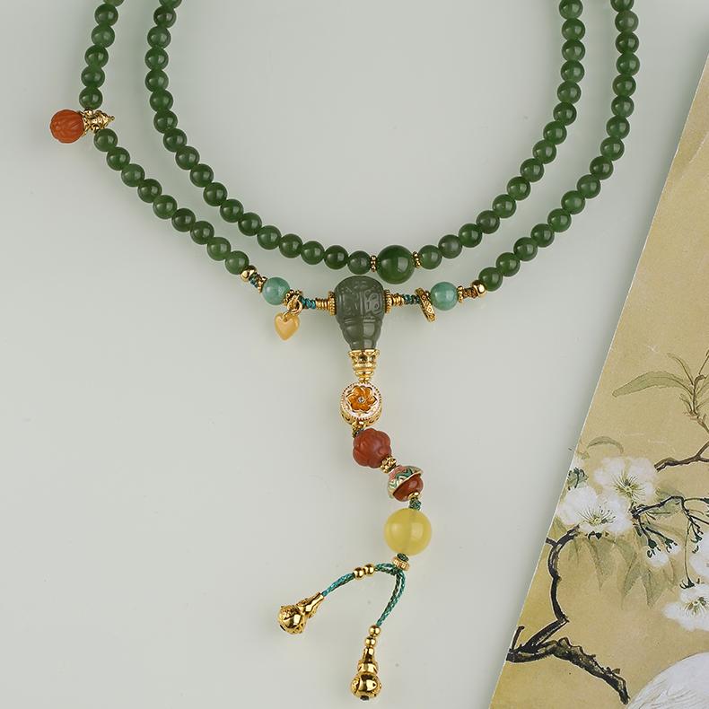 Tibetan Buddhist green jade and jadeite necklace accented with red agate and amber, handcrafted with devotion.