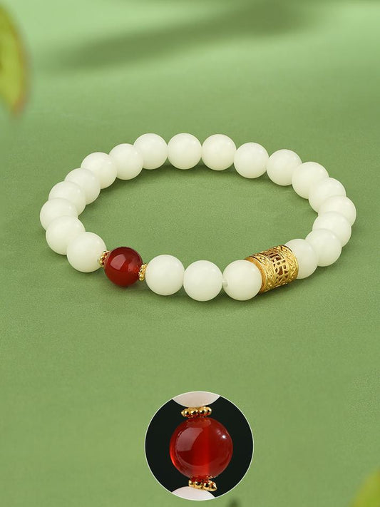 Tibetan-Buddhist Bodhi Jingchuning bracelet featuring red agate and handcrafted silver Potala barrel bead