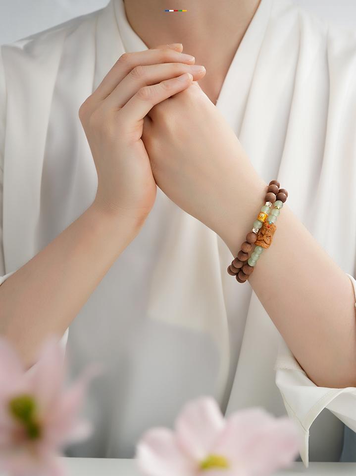 Tibetan-Buddhist handmade mala bracelet crafted from Australian sandalwood and copper lucky beads