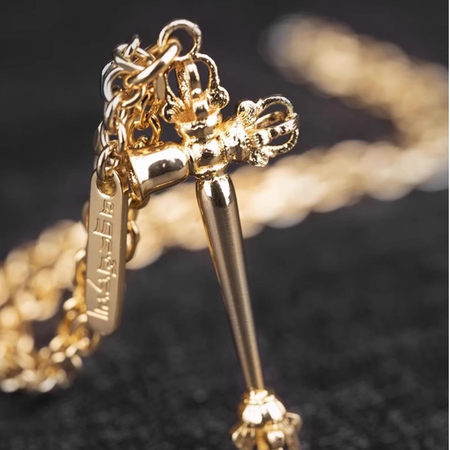 Gold alloy Tibetan necklace inspired by Buddhist wisdom and leadership.