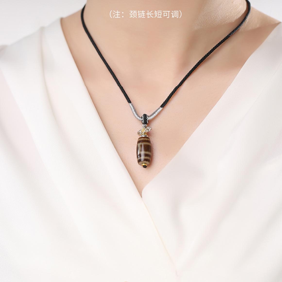 Handcrafted single-eye Dzi agate necklace symbolizing balance and protection.