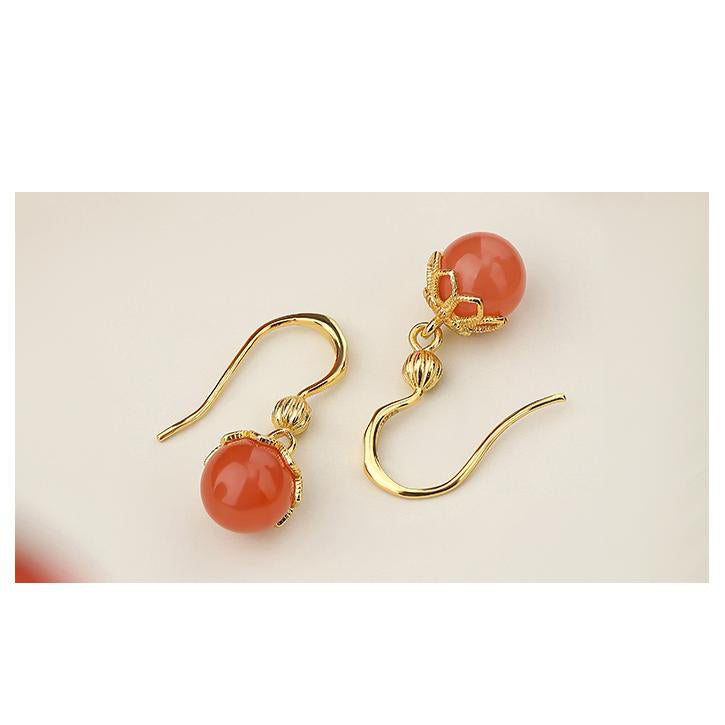 "Tibetan Buddhist South Red Coral ear pendants with 925 silver, designed for spiritual harmony and enlightenment."