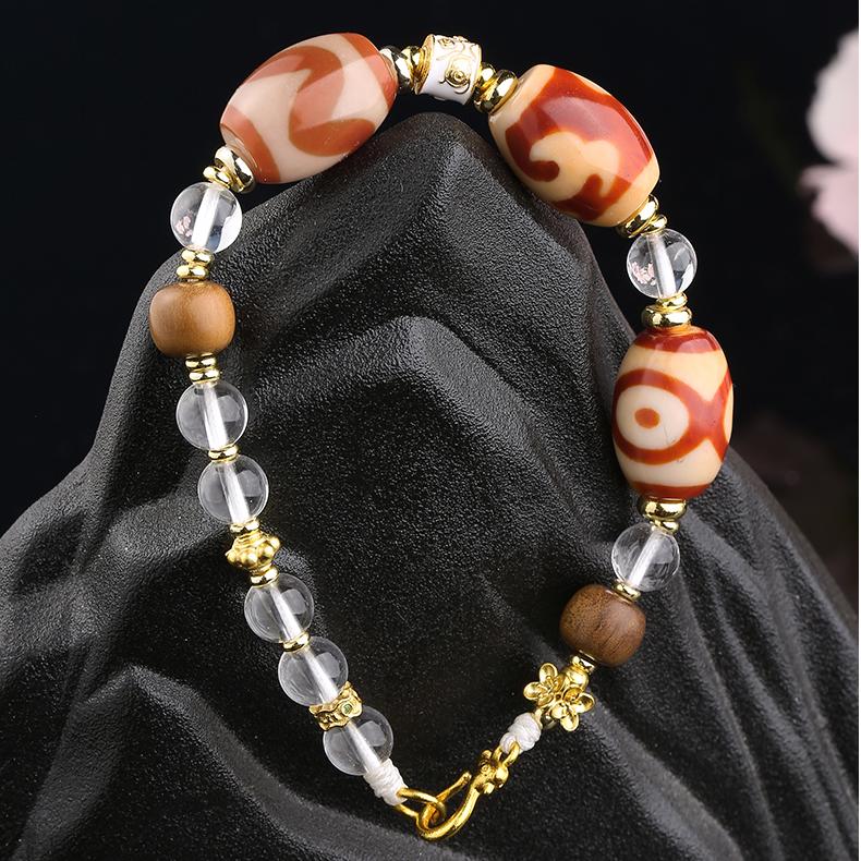 Red agate and white crystal Tibetan pendant-style necklace with copper beads, promoting courage, clarity, and vitality.