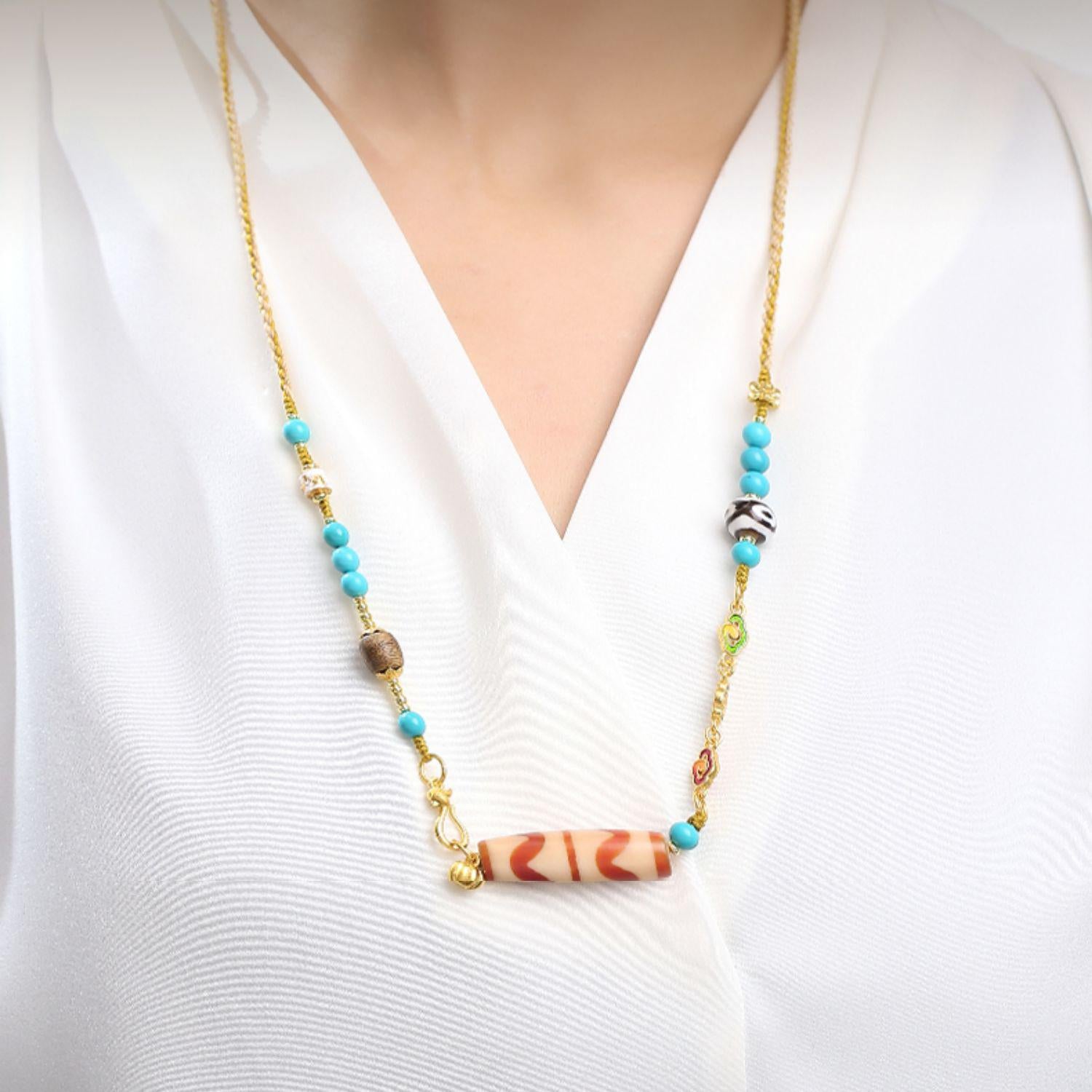 Handcrafted Dzi amulet necklace for protection and spiritual awakening.