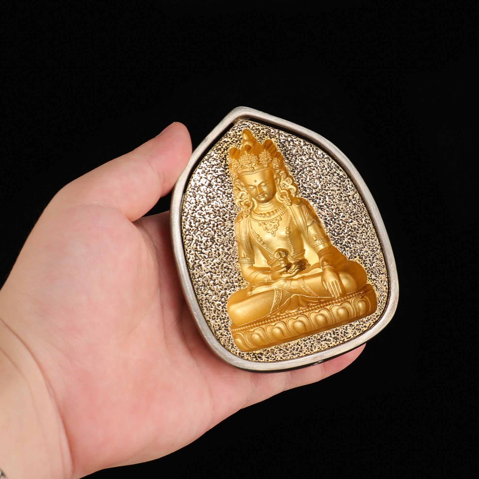 Brass and white copper tsatsa figure handcrafted in Tibetan style.