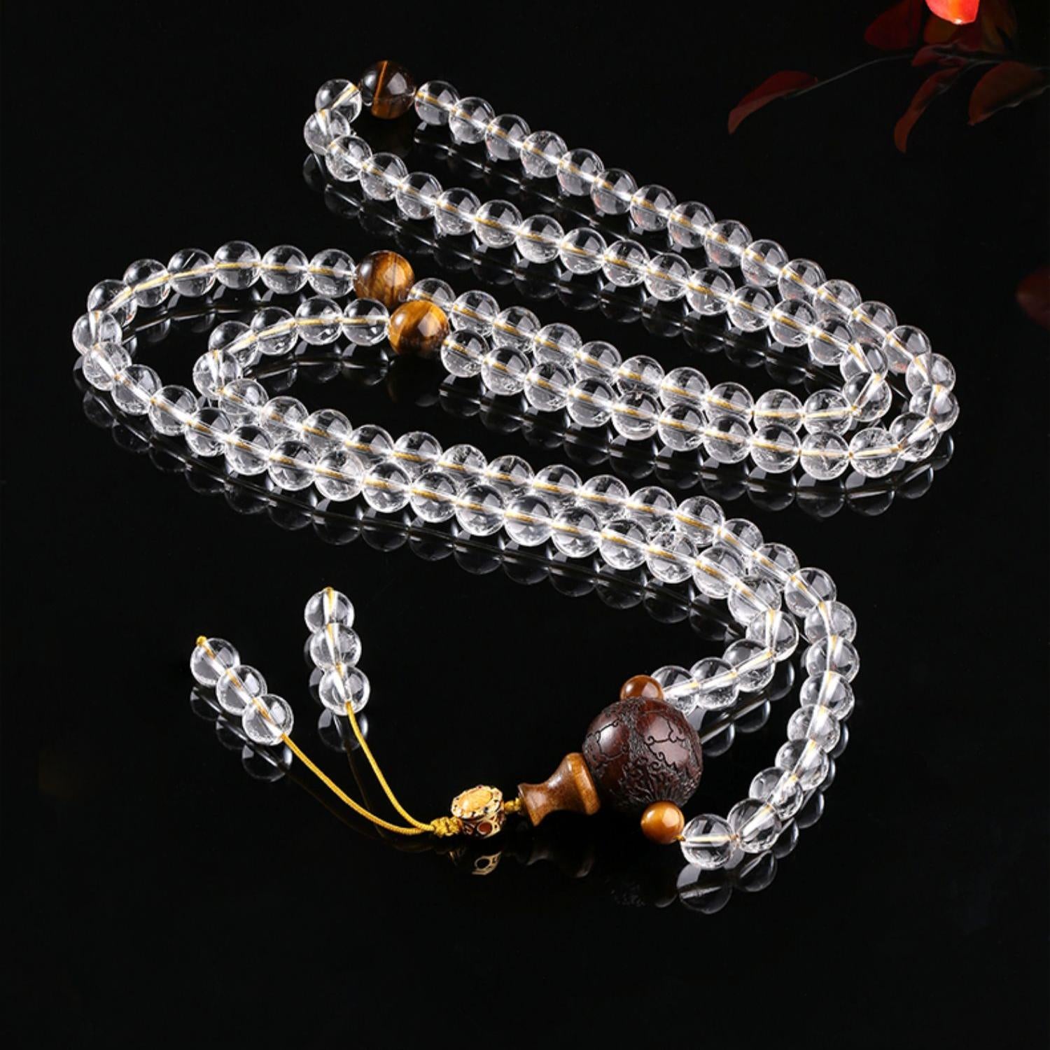 Handmade white crystal and sandalwood meditation necklace from the Shui Yun Jian collection.